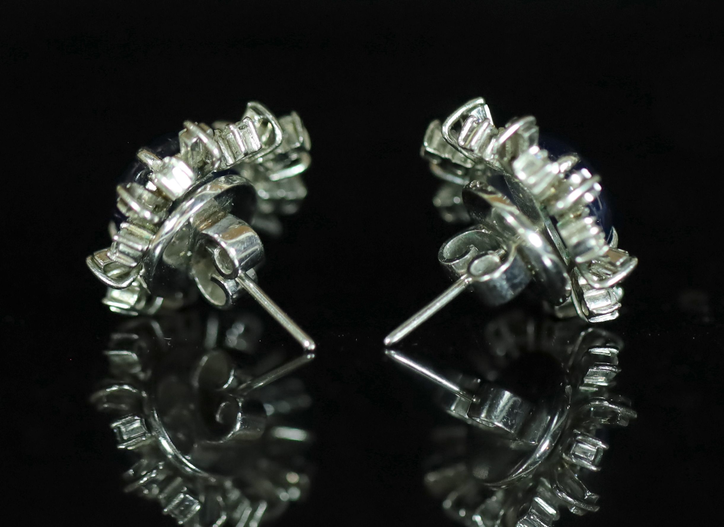 A pair of platinum?, cabochon sapphire and diamond cluster set earrings,